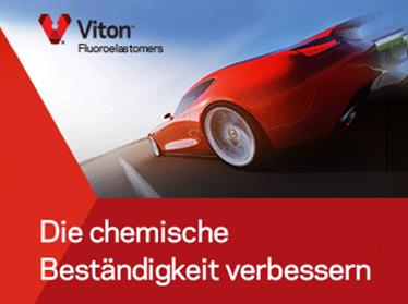 Ein Bild eines roten Sportwagens auf einer asphaltierten Straße.